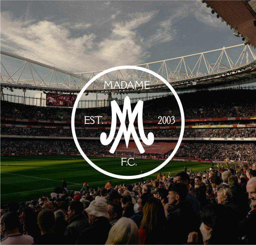 Emblem design for Madame FC depicting an M monogram in a circle with the words "Madame FC EST. 2003" inside on top of a background image of a soccer stadium.