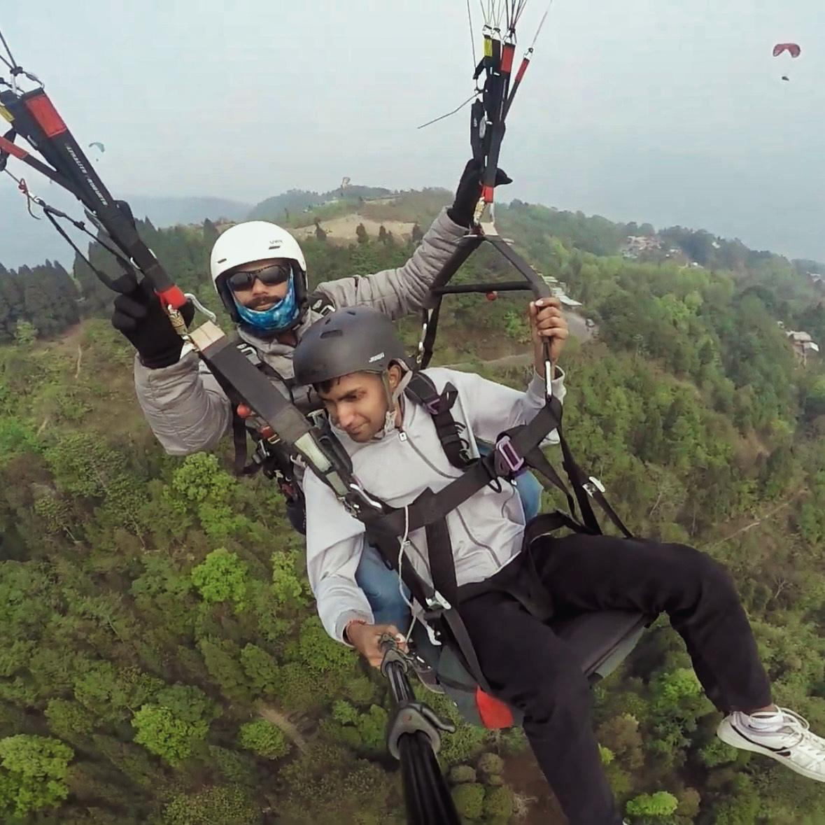 Graphic depicting a mountain peak at sunset cropped in a circle with the words RANGE CRAZY above and below.
